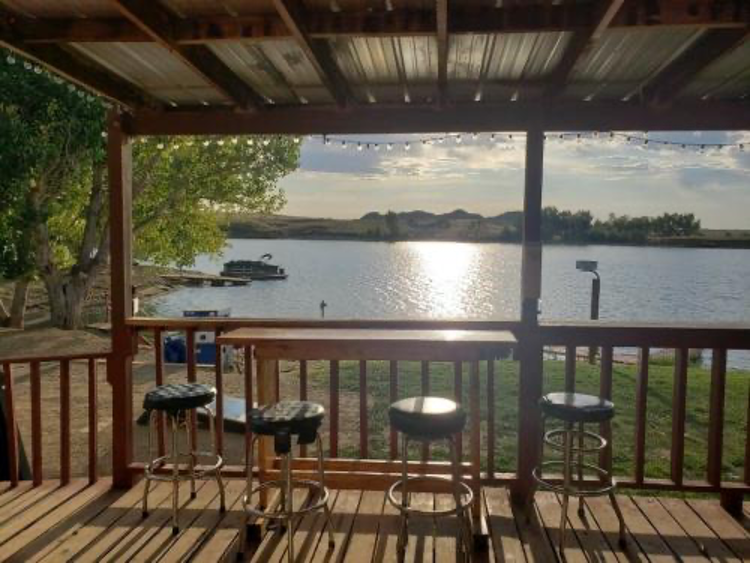 Lakeside cabin porch with lake views and seating