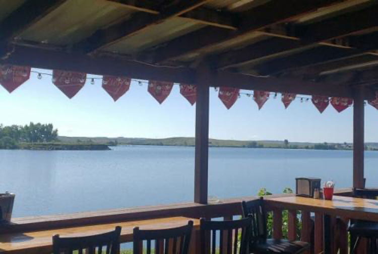 Outdoor patio pavilion with lake views and red bunting